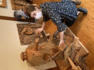 picture of the author posing next to a display in the yokai museum.