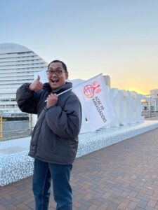 The author holding a Kobe PR Ambassador flag