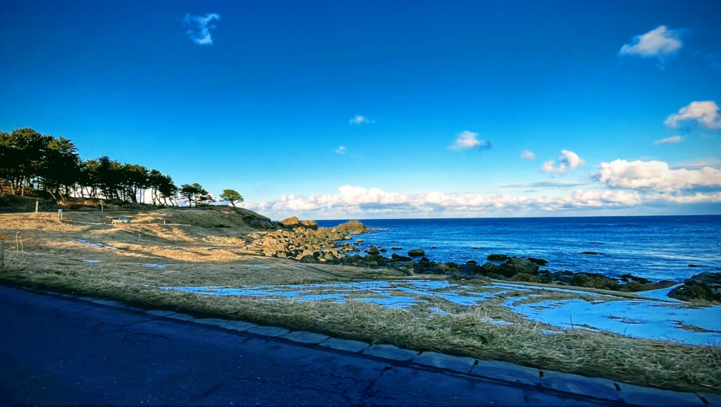 A shaded view of the east coastline creates a sharp contrast with the brighter pictures of the course.