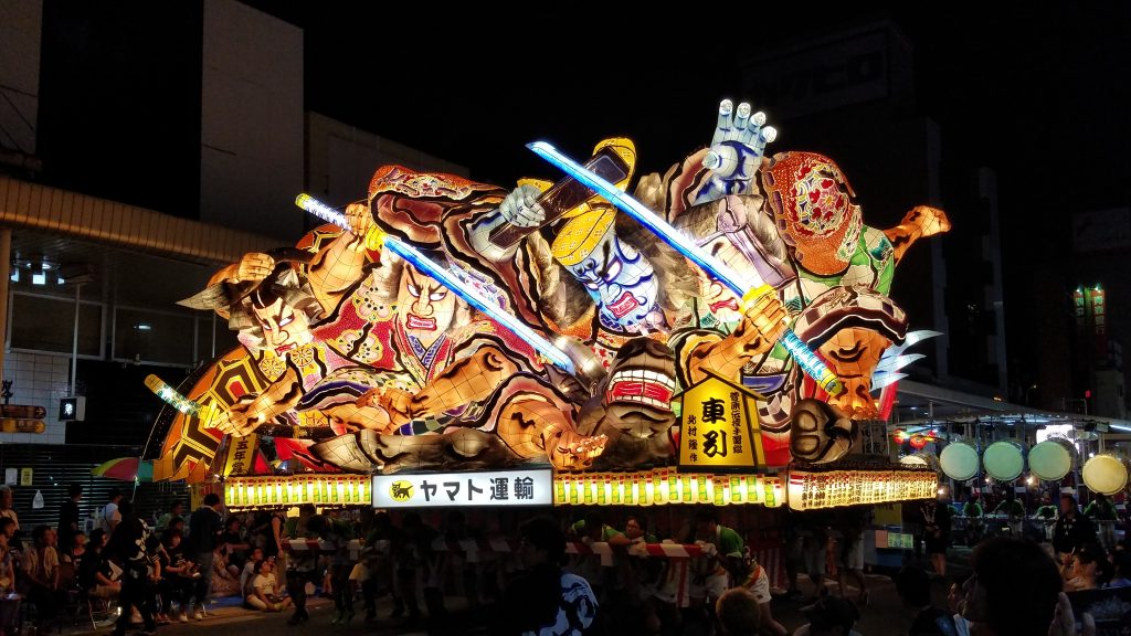 Two warriors facing off with swords at the Nebuta Festival. Photo: Edward Portillo